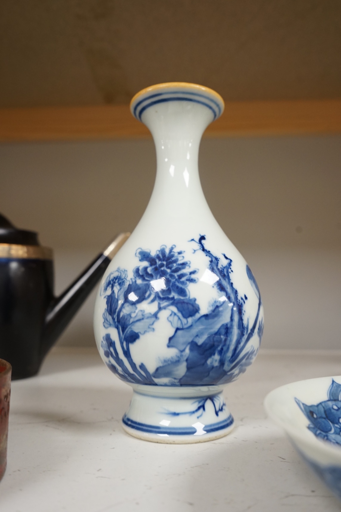 A Chinese blue and white vase and a ‘fish’ saucer dish, largest 19cm high